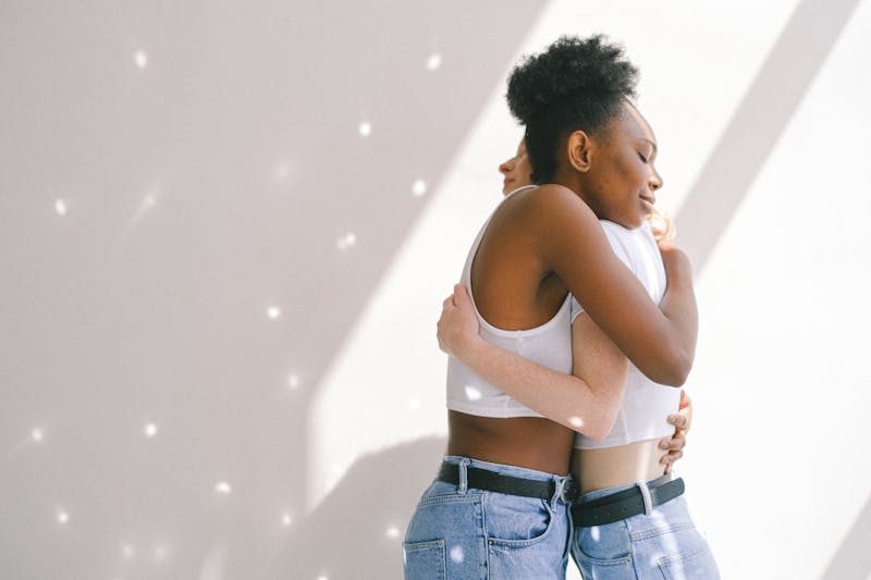 women hugging each other